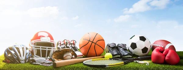 Various Sport Equipment And Balls On Grass