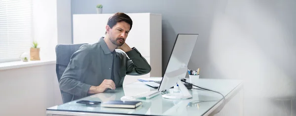 Neck Pain And Stress. Bad Posture At Computer In Office