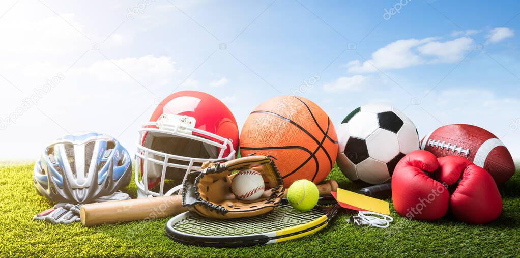Various Sport Equipment And Balls On Grass