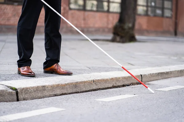 Blind Man Walking With Cane Stick On Road