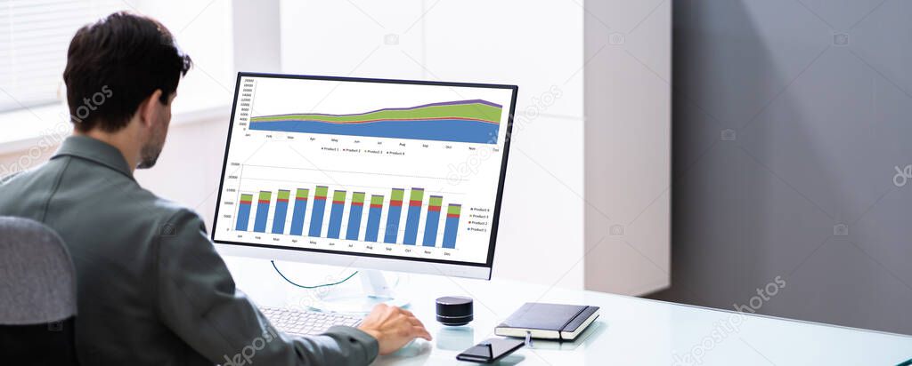 Business Data Analyst Using KPI Data Dashboard On Computer