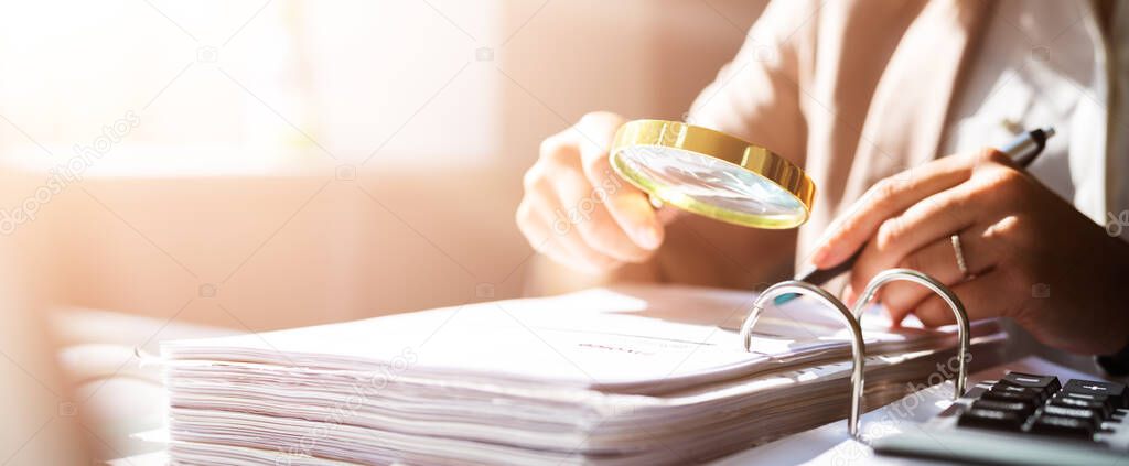 Auditor Woman Using Magnifier Glass For Fraud Investigation