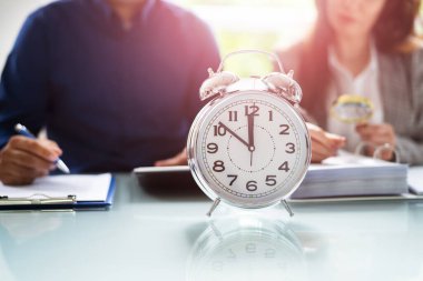 Accountant With Alarm Clock And Calculator. Tax Time