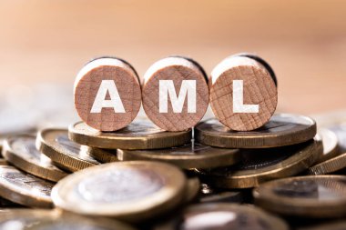 AML Wooden Letter Word. Anti Money Laundering
