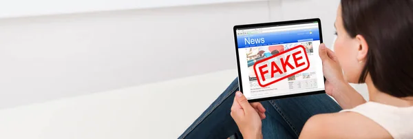 Woman Reading Fake News Online Newspaper Tablet — Stock fotografie