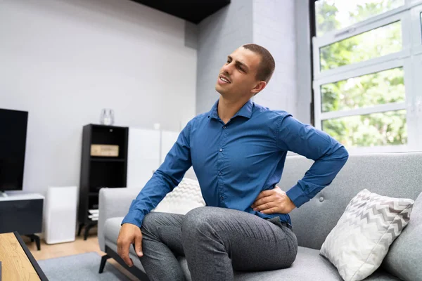 Man Sitting Sofa Having Back Pain — Stok Foto