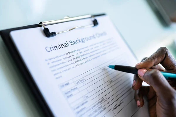 Hand Filling Criminal Background Check Application Form — Stock Photo, Image