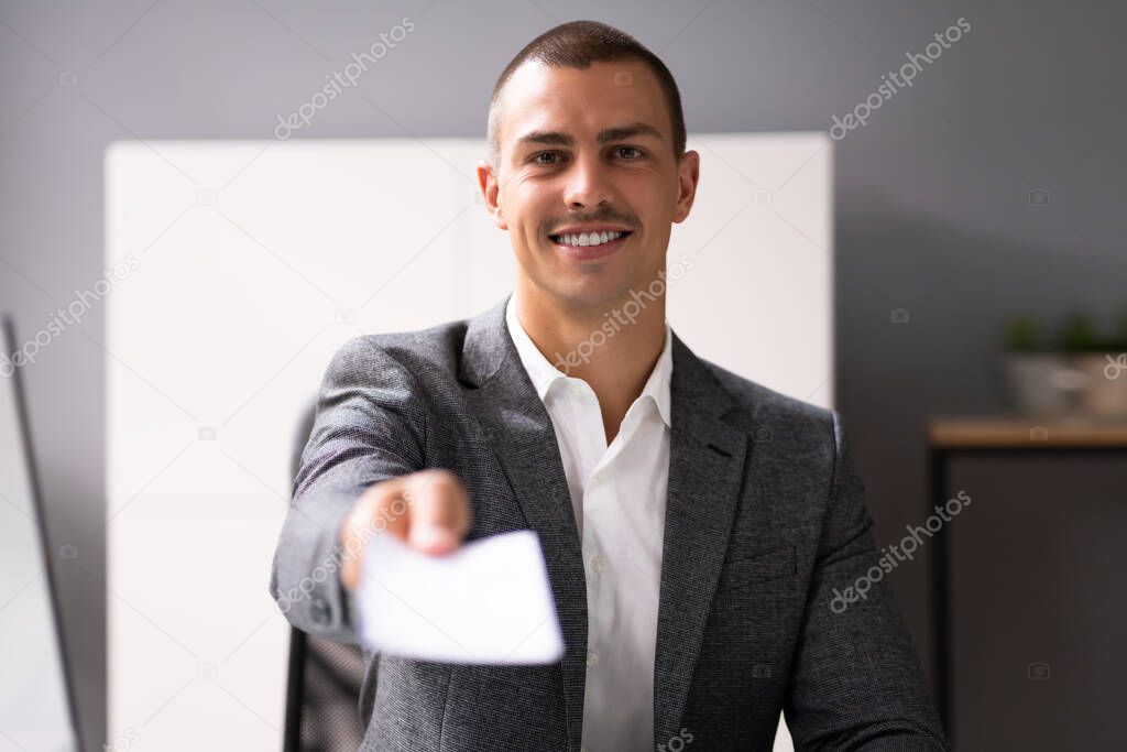 Black Business Man Holding Pay Check Or Paycheck