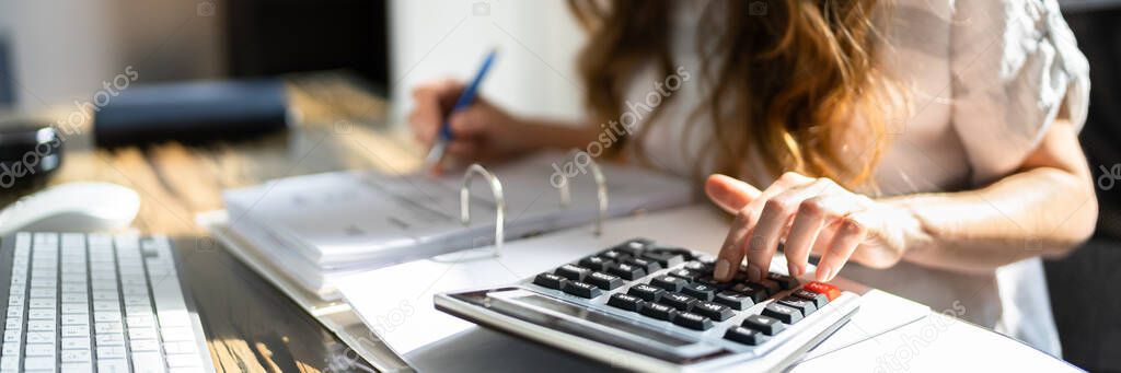 Accountant Calculating Tax. Accounting Woman Using Calculator