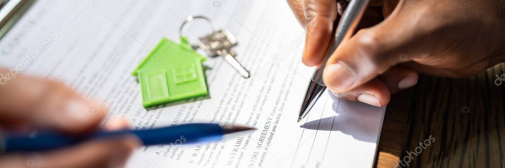 Signing Property Contract Paper. Real Estate Broker