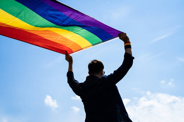 LGBT March And Pride Celebration With Rainbow Flag. LGBTQ Festival