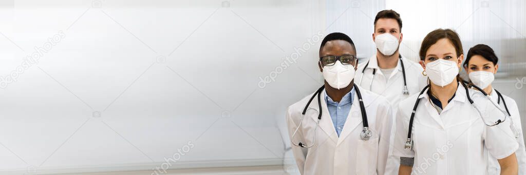 Medical Doctor And Nurse Group Staff In N95 Mask