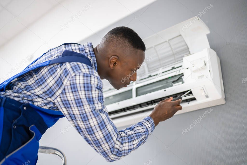 AC Electrician Technician Repairing Air Conditioner Appliance