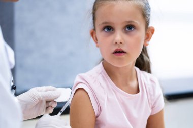 Kid Corona Virus Vaccine Injection. Covid-19 Child Immunization clipart