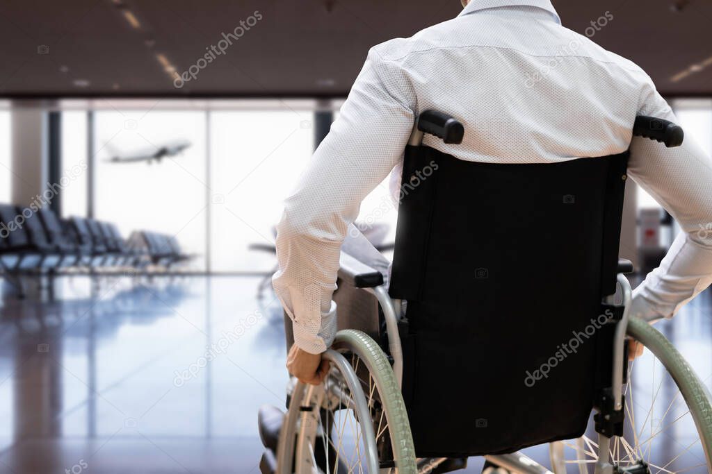 Disabled Adult People Travel In Wheelchair At Airport