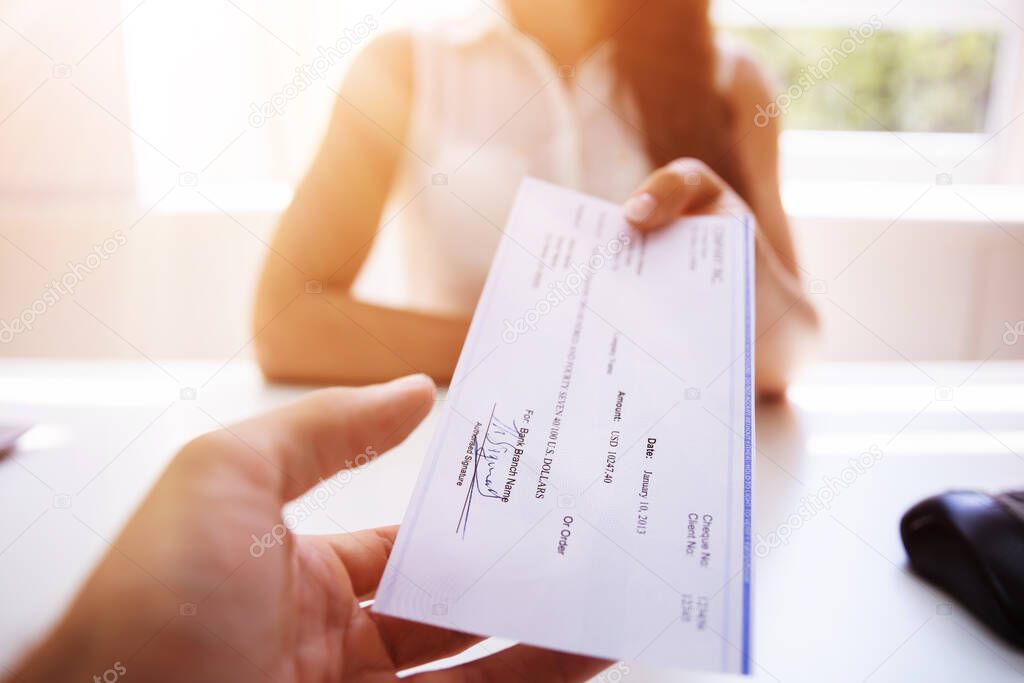 Handing Payroll Cheque To Employee. Salary Check