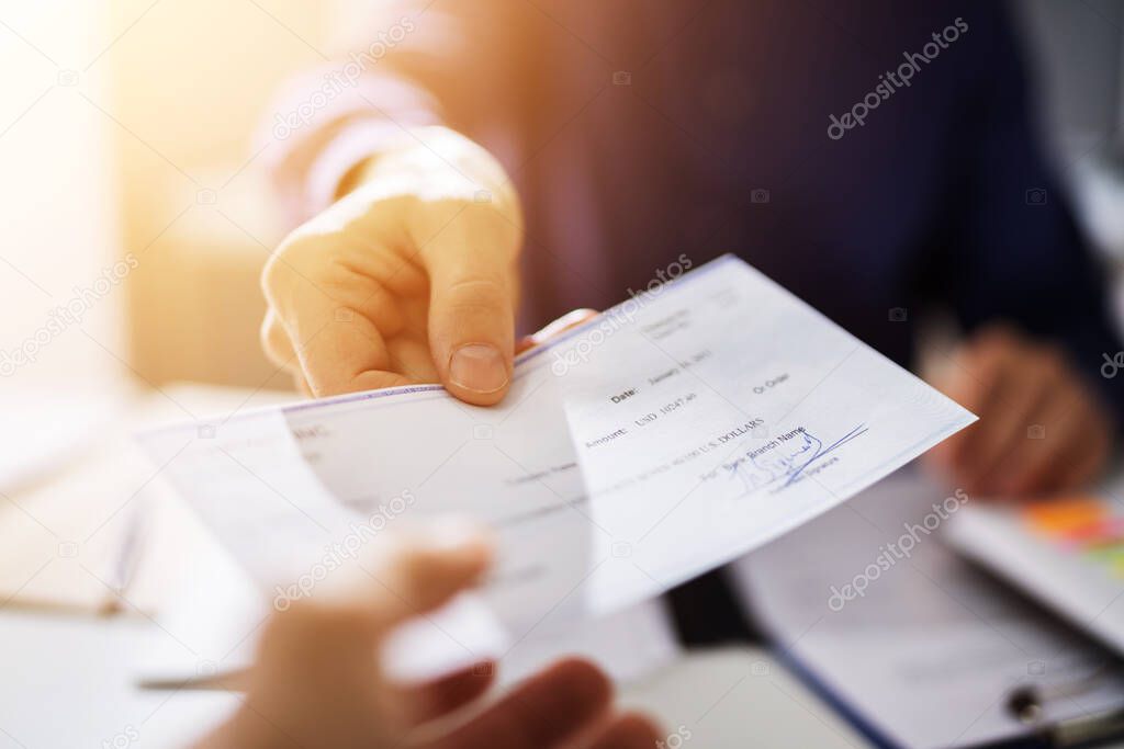 Handing Payroll Cheque To Employee. Salary Check