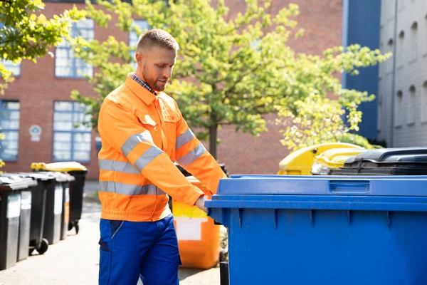 Garbage Removal Man Doing Trash And Rubbish Collection