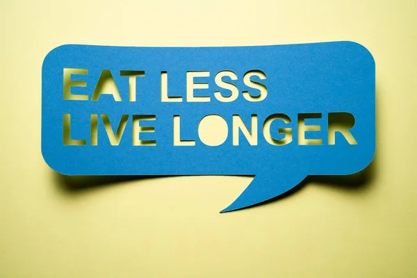 Eat Less Live Longer Motivational Message Sign — Stock Photo, Image