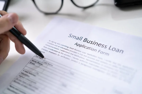 Person Hand Small Business Loan Application Form — Stock Photo, Image