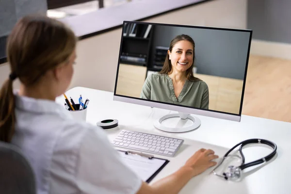 Doctor In Video Conference Call With Sick Patient