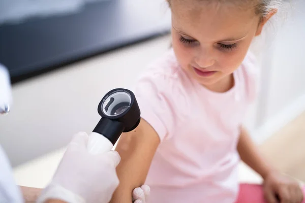 Medical Doctor Examining Child Doctor Using Dermatology Device — Stock Photo, Image