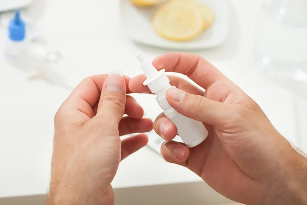 Hands Holding Nasal Drop Bottle — Stock Photo, Image