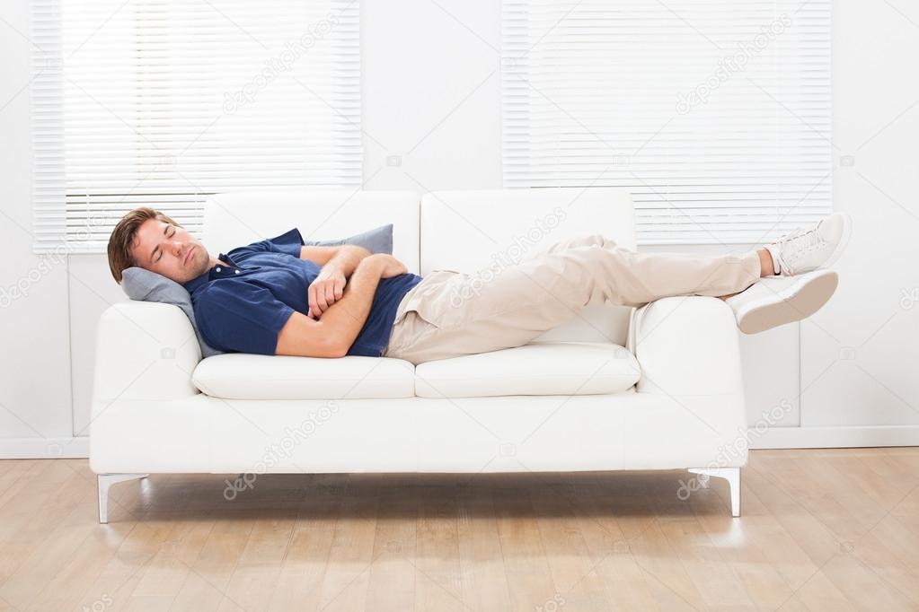 Man Sleeping On Sofa