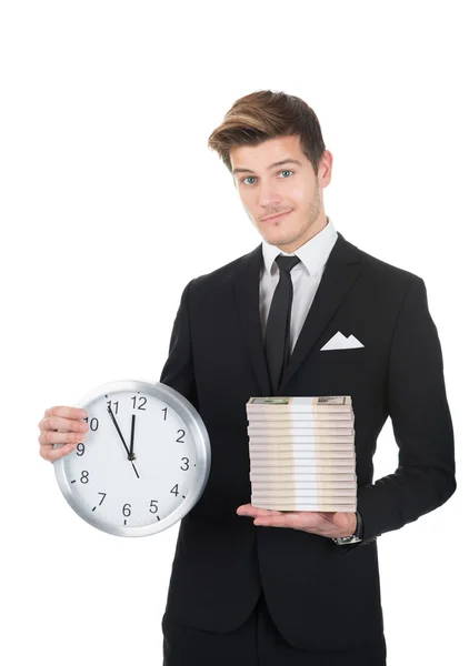 Confident Businessman Holding Clock And Stacked Papernotes — Stock Photo, Image