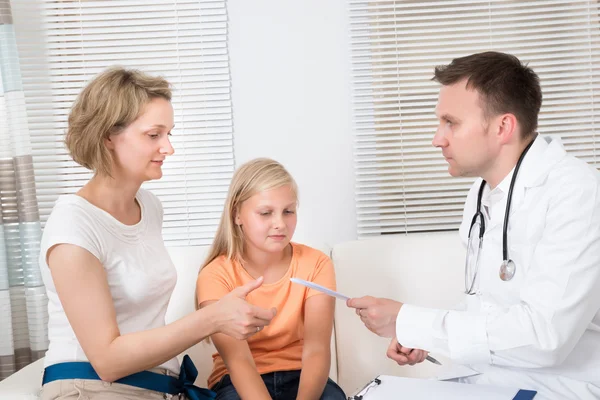 Doctor Child Patient And Mother Stock Image