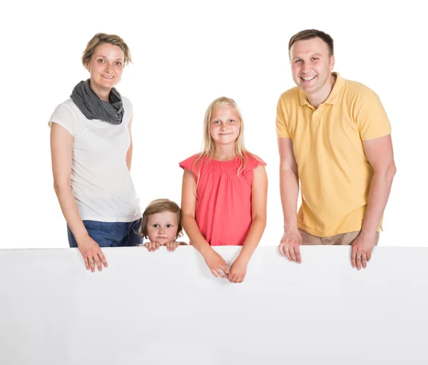 Happy Young Family Holding Banner — Stock Photo, Image