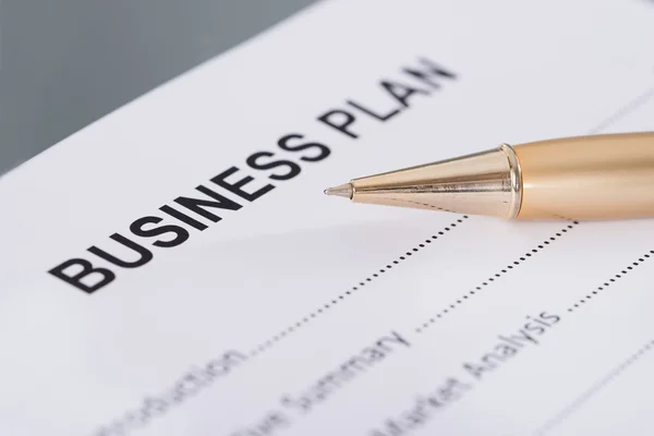 Business plan and pen — Stock Photo, Image