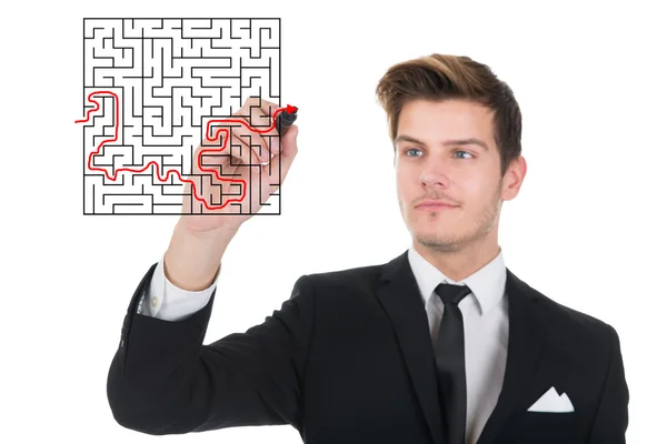 Businessman Solving Maze Puzzle On Transparent Screen — Stock Photo, Image