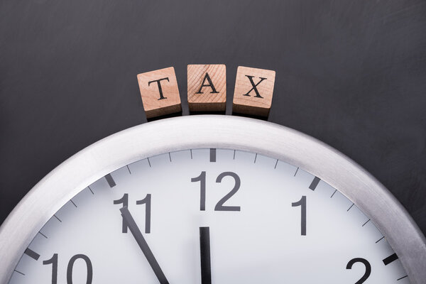 Clock showing tax time Royalty Free Stock Photos