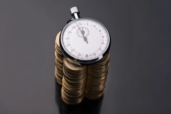 Stopwatch on stack of euro coins — Stock Photo, Image