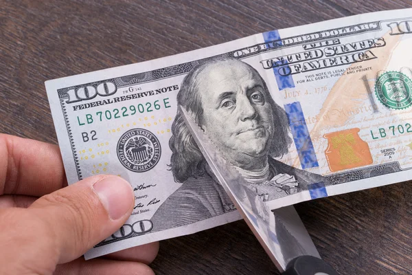 Cutting dollar currency — Stock Photo, Image