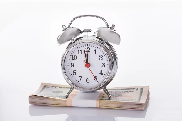 Alarm Clock on US Dollars — Stock Photo, Image