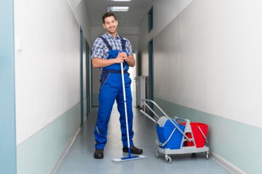 Male Worker With Broom clipart