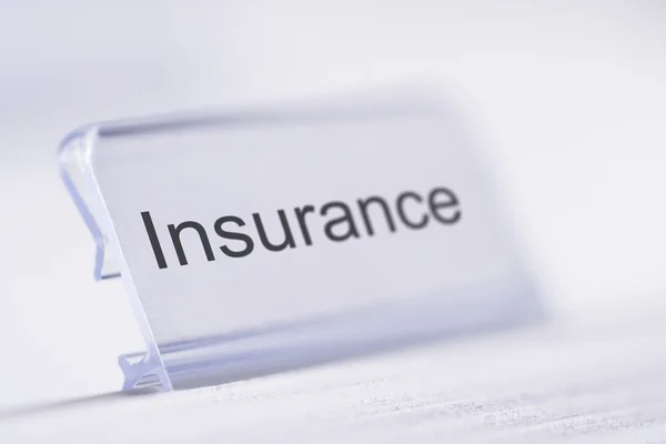 Insurance Tag On Table — Stock Photo, Image