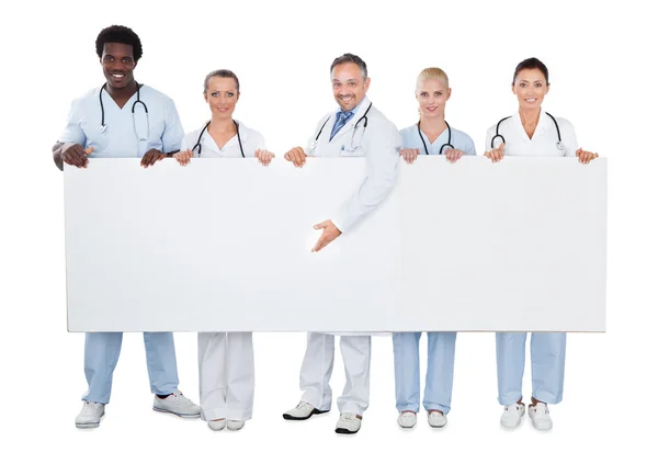 Doctor con equipo — Foto de Stock