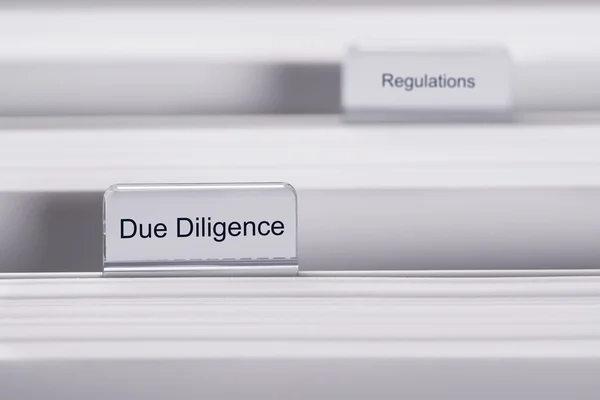 Due Diligence And Regulations Folders — Stock Photo, Image
