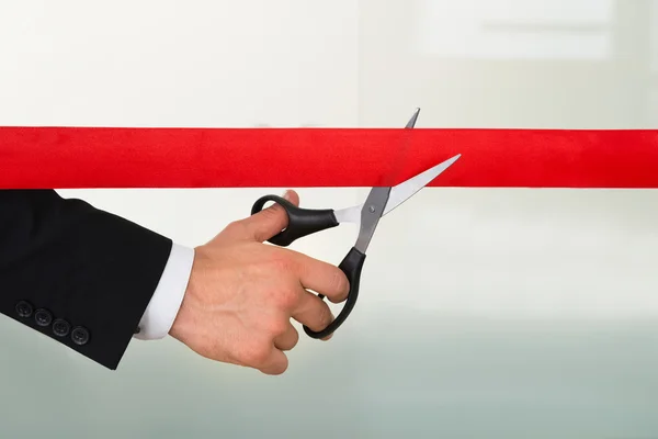 Businessman Cutting Red Ribbon — Stock Photo, Image