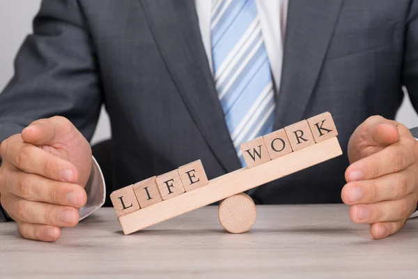 Businessman Covering Imbalance — Stock Photo, Image