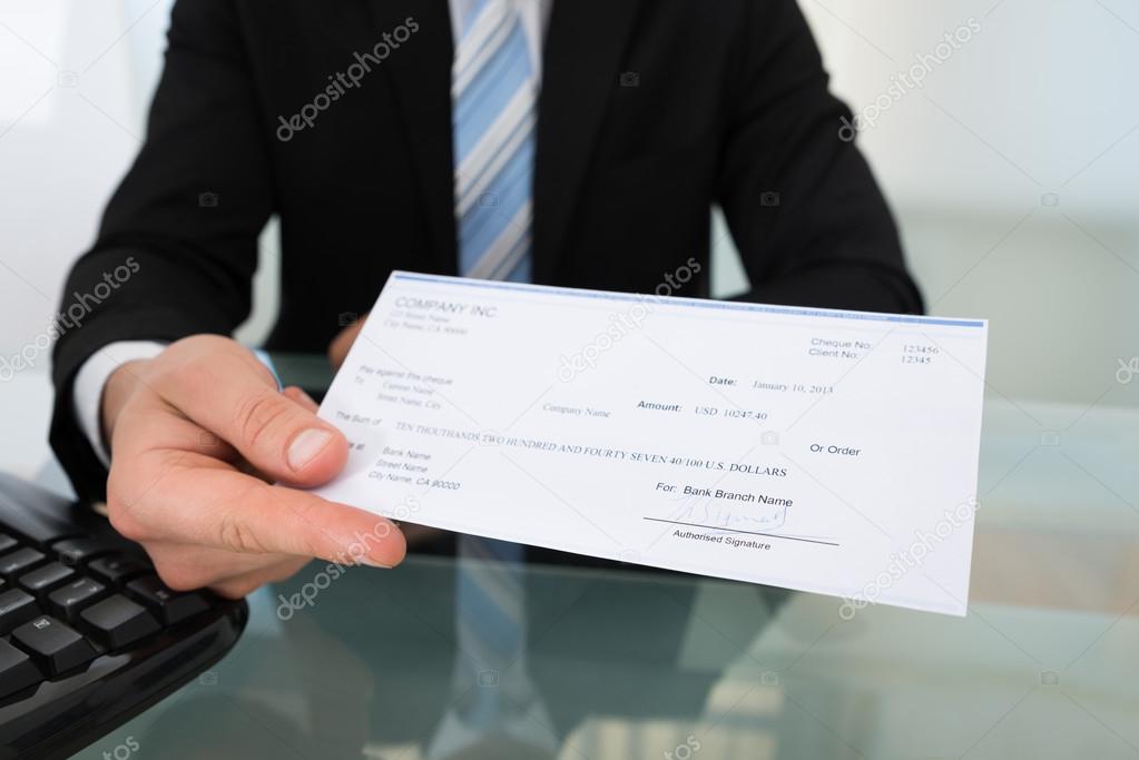 Businessman Giving Cheque
