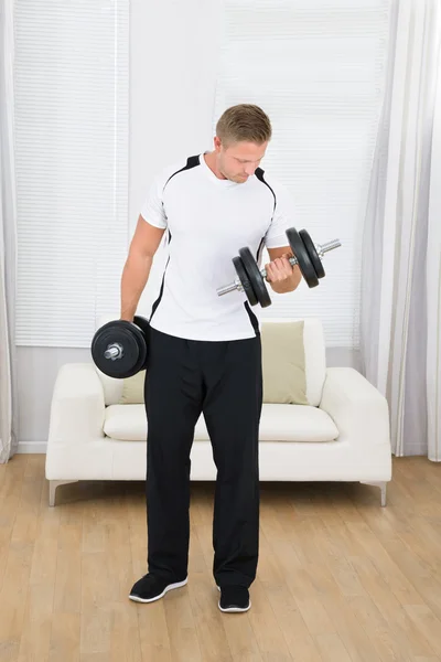 Muscular Man Lifting Weights Royalty Free Stock Photos