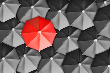 Red Umbrella Surrounded By Black Ones clipart