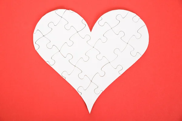 Herzform aus Puzzle — Stockfoto