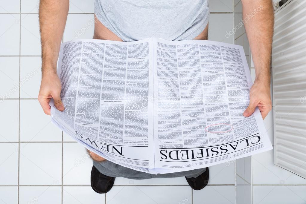 Man In Toilet Reading Newspaper