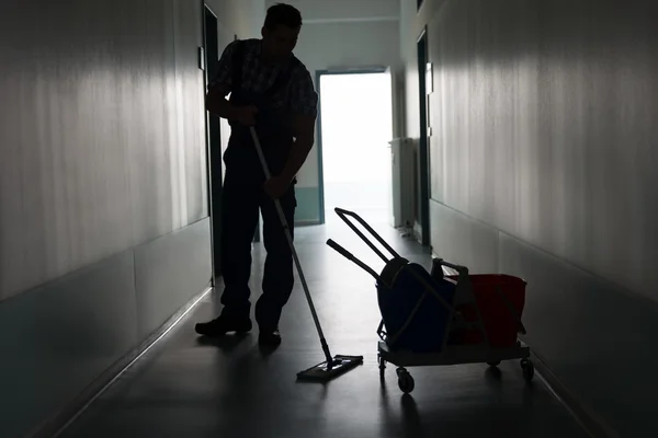 Male Worker Cleaning Office Corridor — Stock Photo, Image