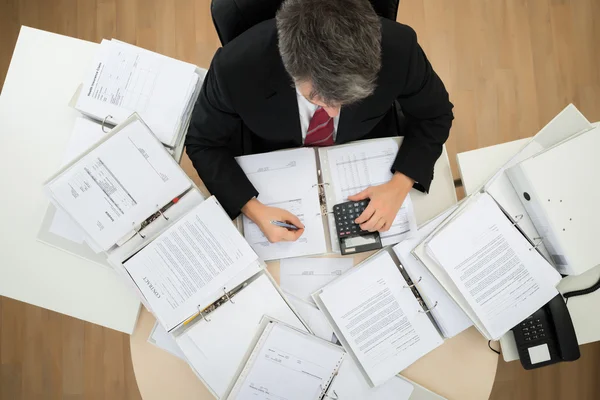 Businessman Calculating Bills — Stock Photo, Image